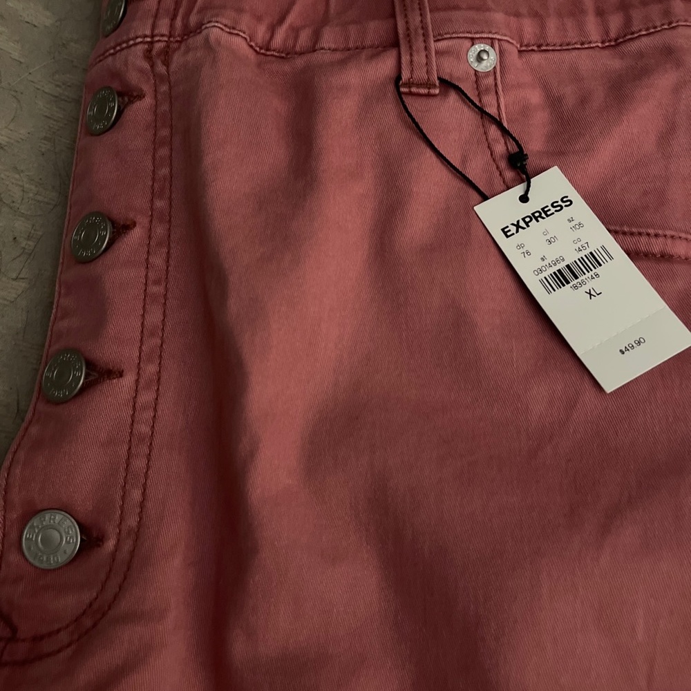 Pink paper bag waisted shorts.